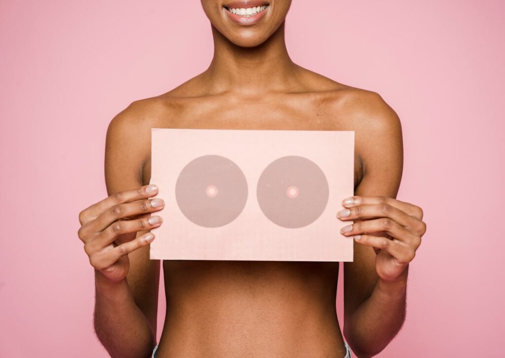 A conceptual image highlighting breast cancer awareness with a woman holding a symbolic card.